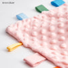 Pink baby sensory tag comfort blanket with soft texture and yellow ribbon