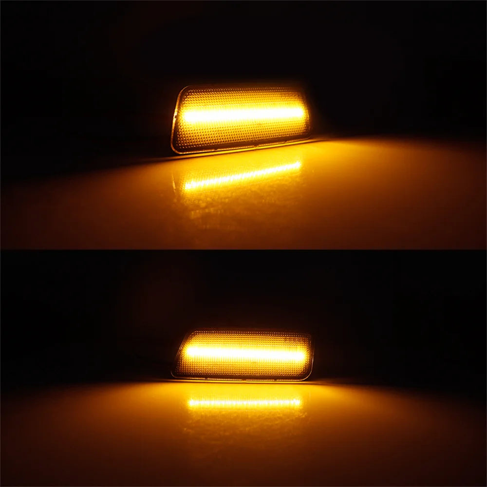 A close-up of an LED front side marker light illuminating a reflective surface.