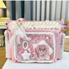 A pink Y2K Lolita transparent shoulder bag with white lace trim and decorative elements.
