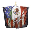 A dark fabric cape featuring the flag of Mexico and the United States, displayed on a mannequin.