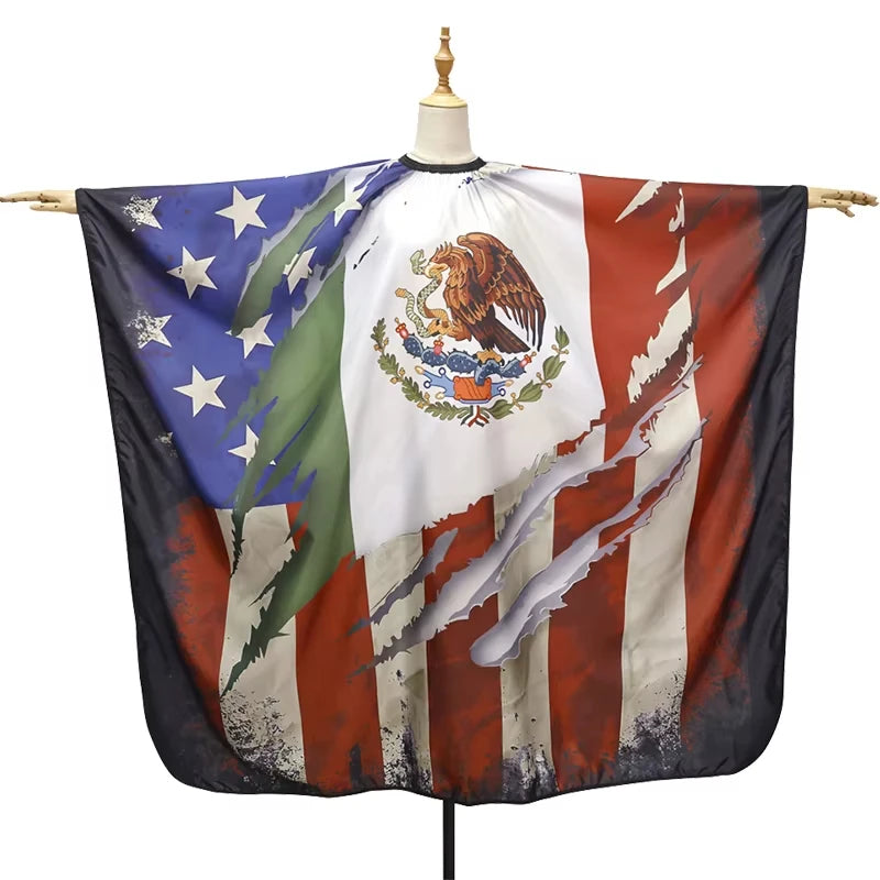 A dark fabric cape featuring the flag of Mexico and the United States, displayed on a mannequin.