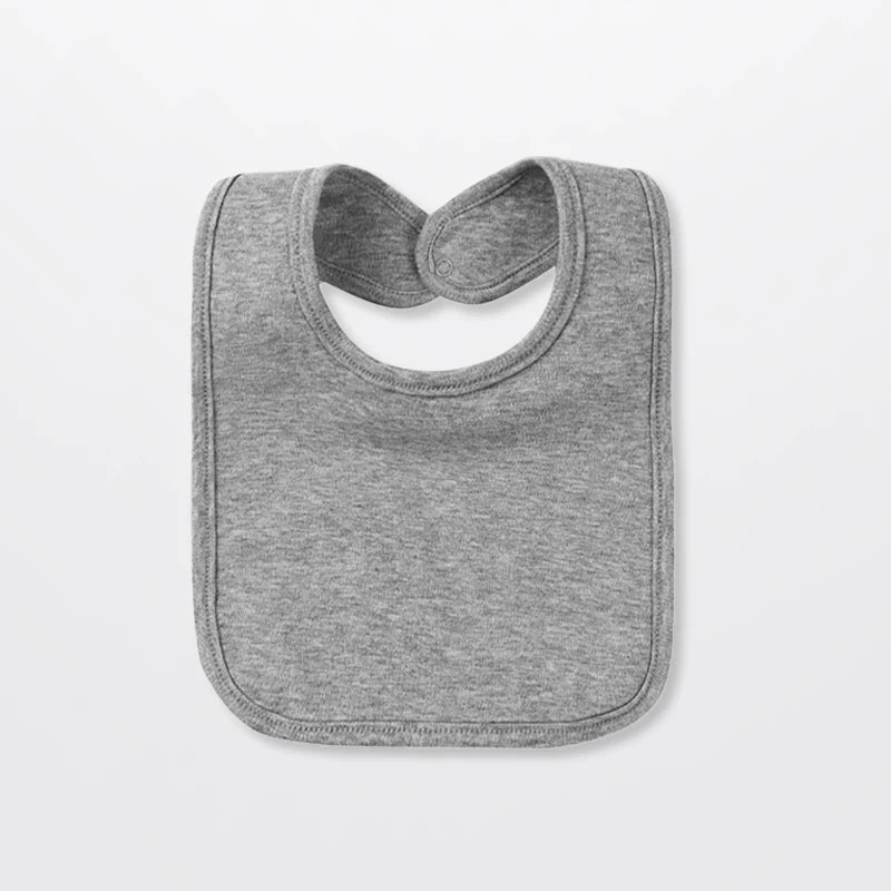 A gray cotton bandana bib for babies shown flat.