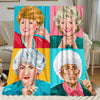 A colorful pop art print featuring four portraits of the Golden Girls women on a flannel throw blanket.
