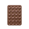 A brown silicone suction pad with multiple circular indentations for phone mounts.