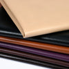 Stack of self-adhesive PU leather repair patches in various colors including beige, black, and brown.