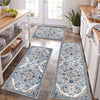 A long rectangular blue and white patterned kitchen rug placed on a wooden floor.