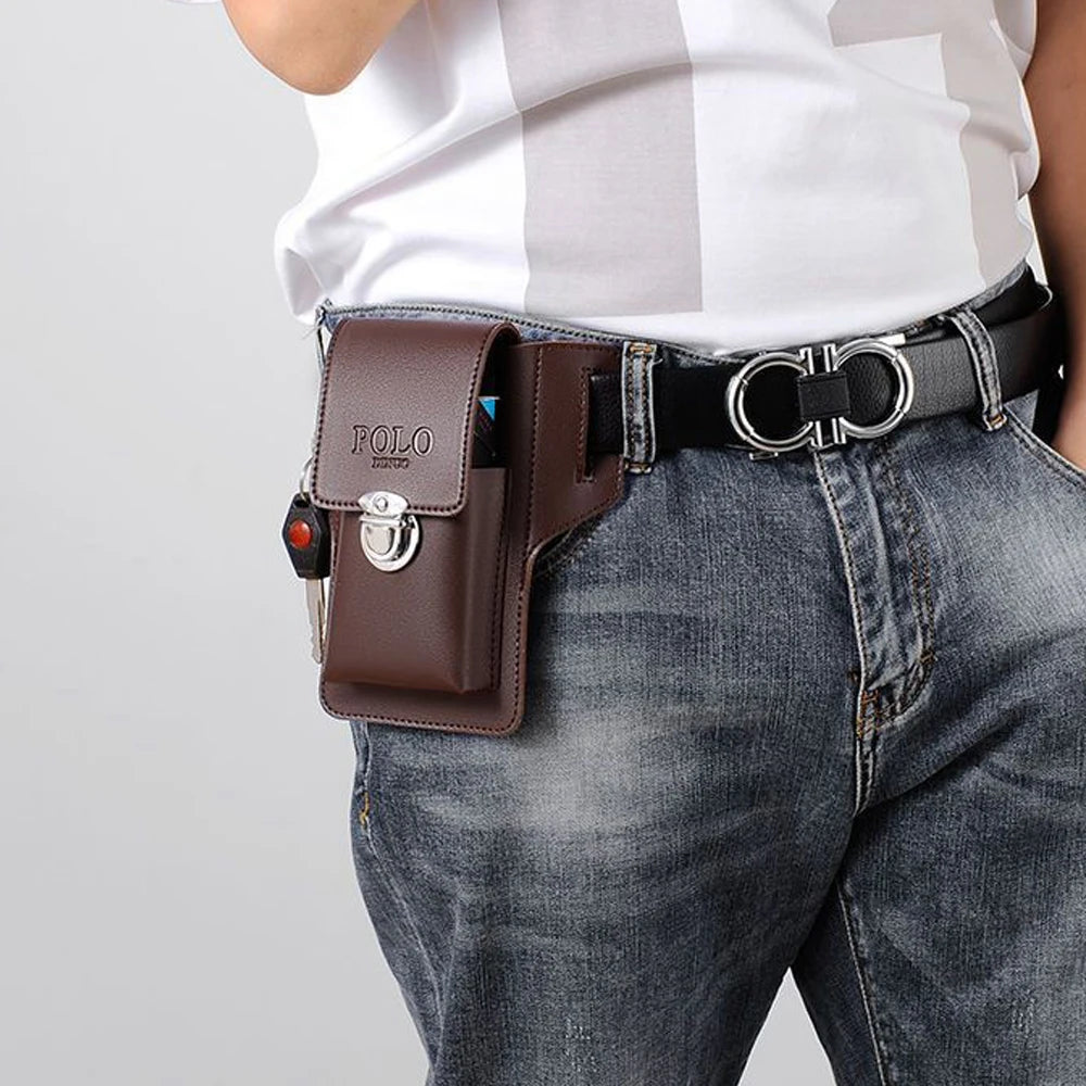 A brown leather waist bag with a silver buckle is worn on a dark denim jean belt.