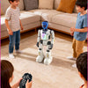 A child interacts with an interactive gesture-control robot while other children watch.