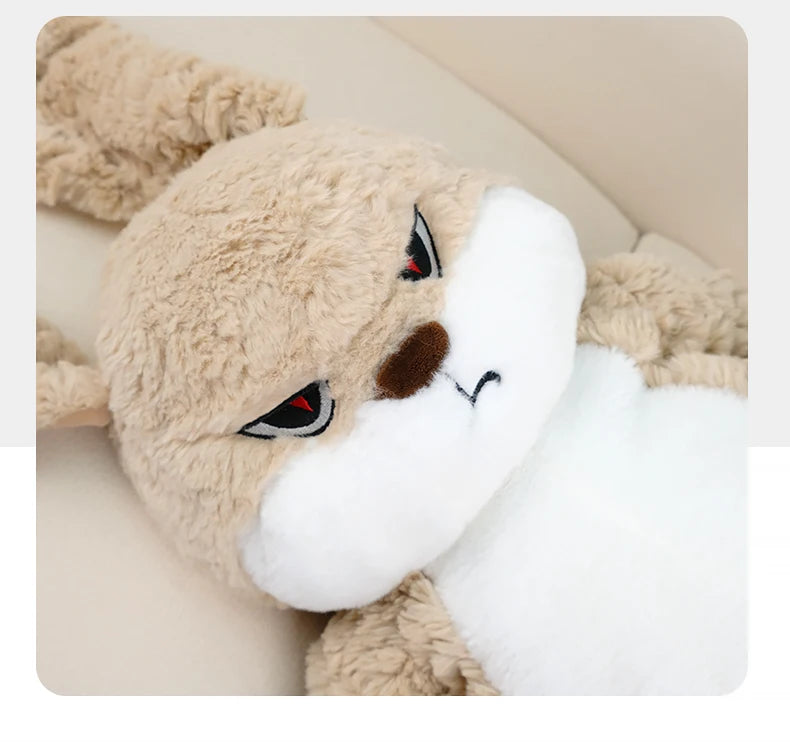 A fluffy beige and white long-eared rabbit plush toy looking to the side.
