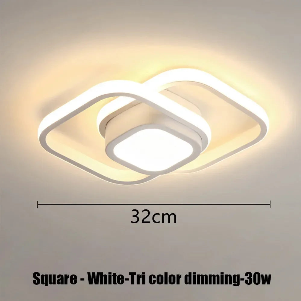Square white tri color dimming LED ceiling light fixture with a modern, curved design.
