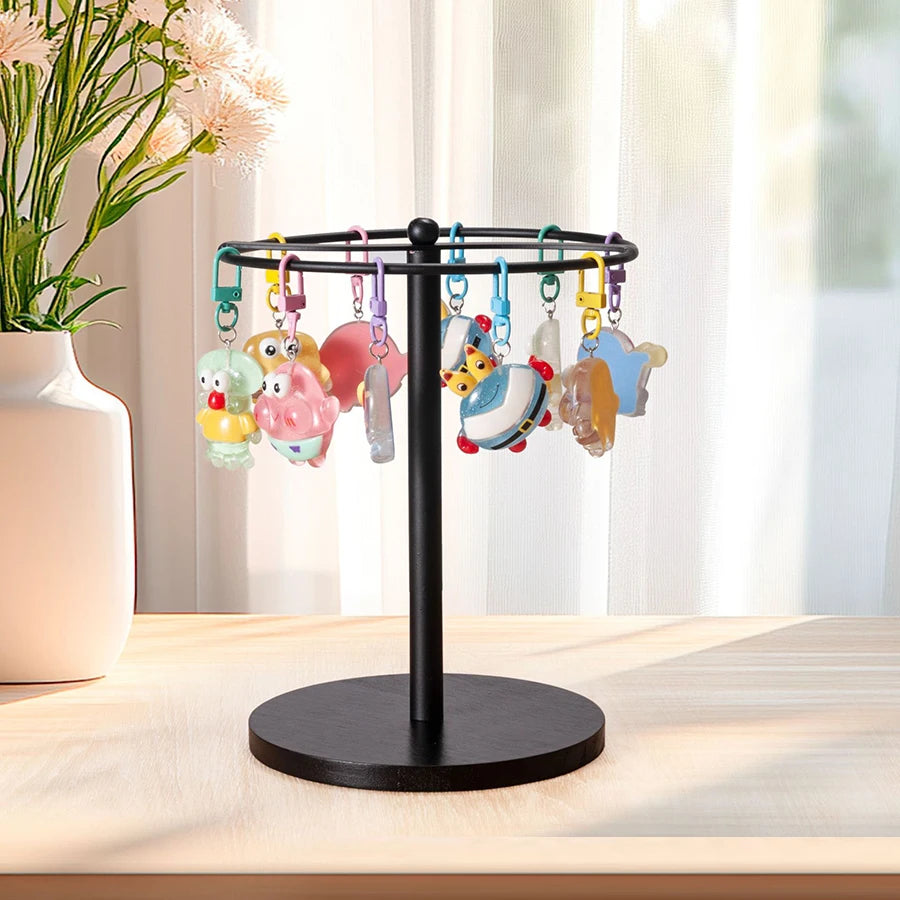 A black stand with hooks holds twelve pairs of colorful sunglasses and glasses.
