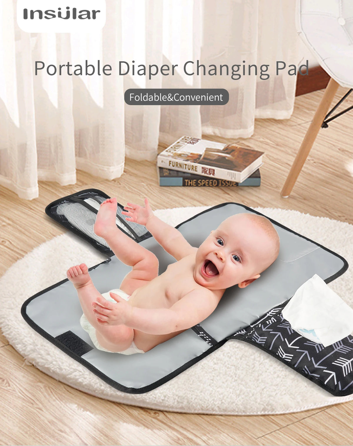 A portable foldable diaper changing pad is shown on a white rug with a baby lying on it.