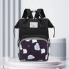A black waterproof diaper backpack with a bear print pattern displayed on a white pedestal.