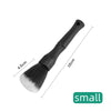 A black soft bristle detailing brush with a handle and wide bristles is shown against a white background.