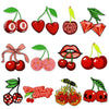 A collection of ten embroidered cherry iron-on patches in various colors and designs.