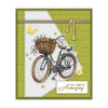 A vintage bicycle with flowers and oranges is depicted on a green background, suitable for card making.