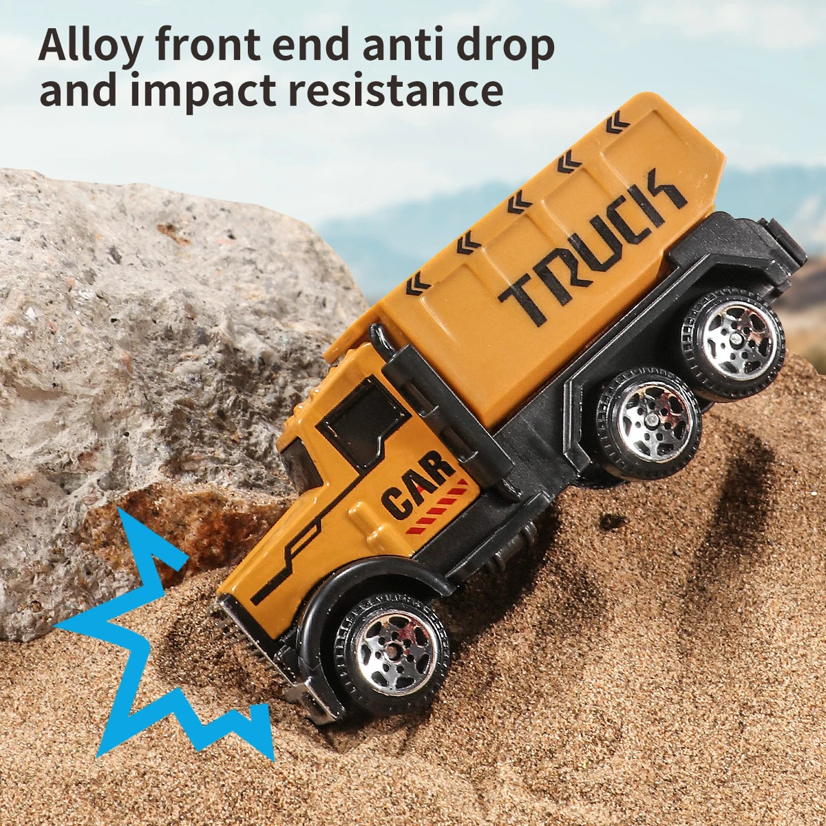 A yellow truck toy is shown impacting sand, demonstrating alloy front end anti-drop and impact resistance.