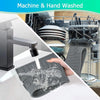 A hand is washing a silicone faucet mat and sink splash guard under running water.