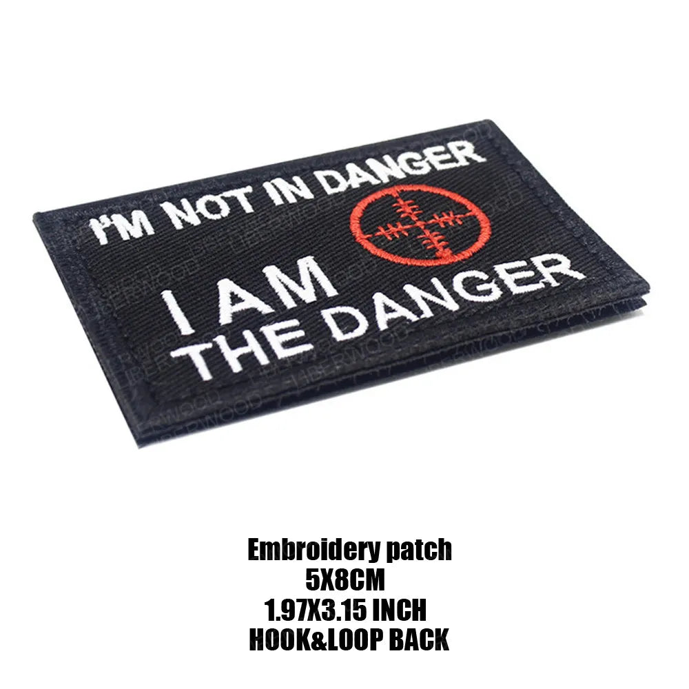 Black embroidered patch with white text that reads I'M NOT IN DANGER I AM THE DANGER