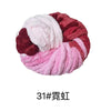 A ball of chunky acrylic yarn featuring a marbled pattern of pink and deep red colors.