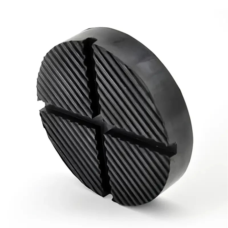 Black rubber jack pad with a cross-shaped design for car pinch welds