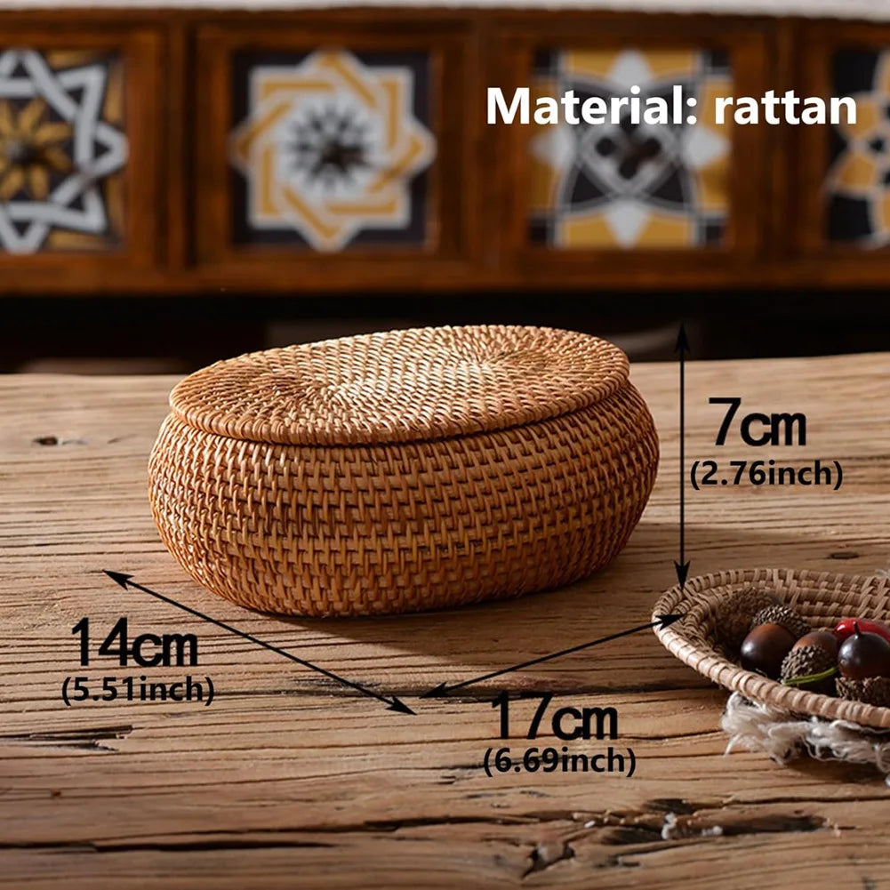 Handwoven rattan storage basket with lid shown on a wooden surface.