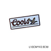 A black and white embroidered patch with the word Coors and a small bird design on a rectangular background.