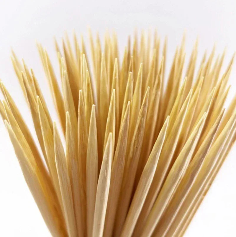 A close-up view of a bundle of natural bamboo skewers for BBQ and grilling.
