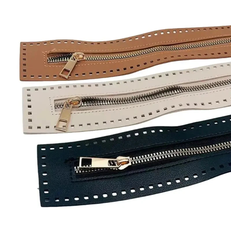Three leather zippers in tan, cream, and dark blue colors for handbags and sewing projects