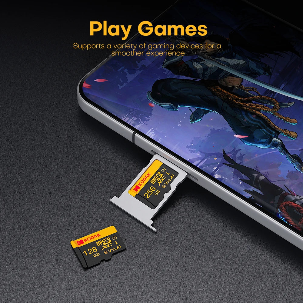 A close-up of a Kodak microSD card inserted into a smartphone, demonstrating its use for playing games.