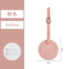 A pink PU leather luggage tag with a round cutout and a rectangular attachment loop.