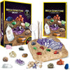 A box set of a Mega Gemstone Dig Kit showing various colored and clear crystals, including amethyst and quartz, laid out on a