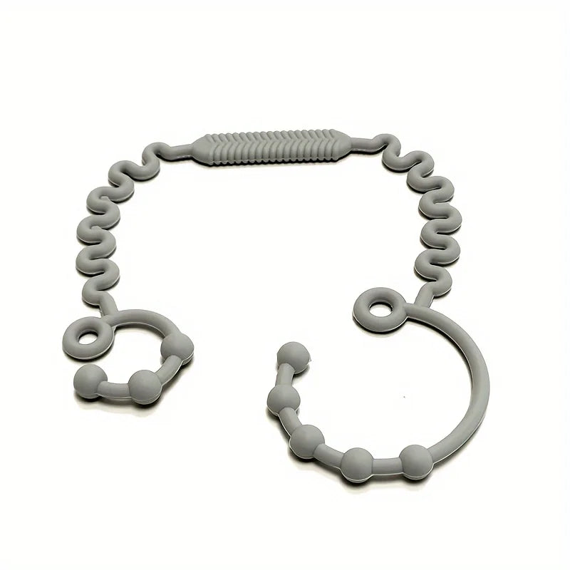 A gray silicone anti-drop pacifier clip with a teether, shaped like a loop.