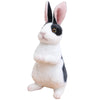 A white and black plush rabbit stuffed animal with long ears.