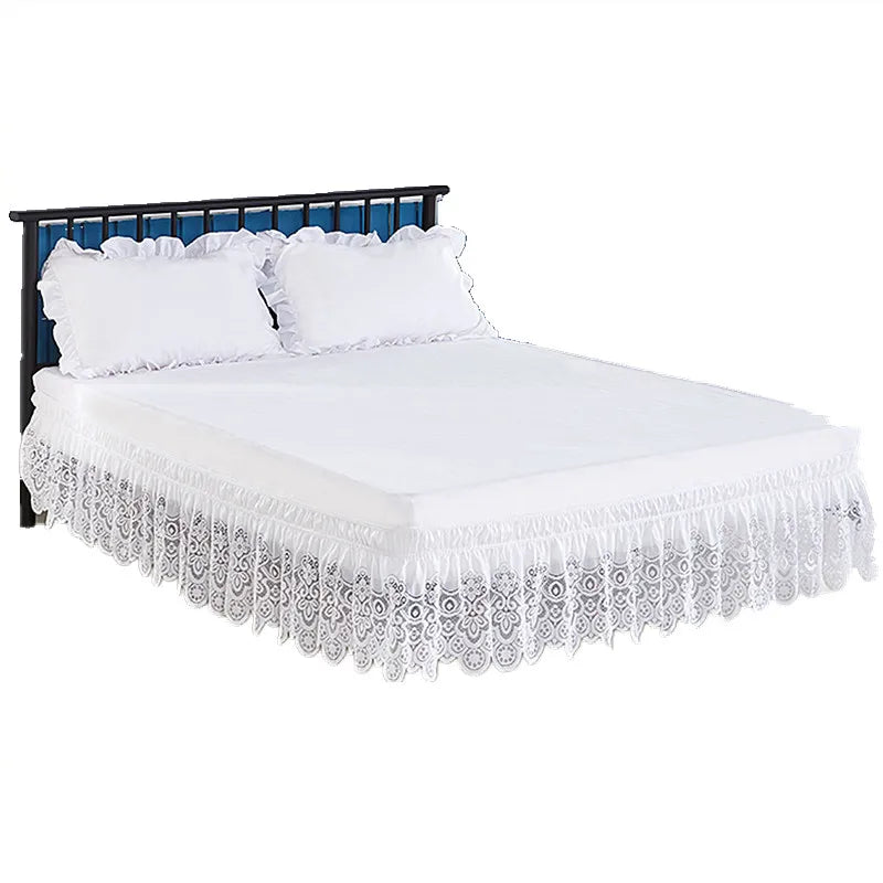 White Jacquard lace bed skirt with elastic band and 15 inch drop on a dark metal bed frame.
