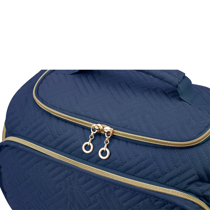 Navy quilted travel toiletry bag with gold zipper and handle