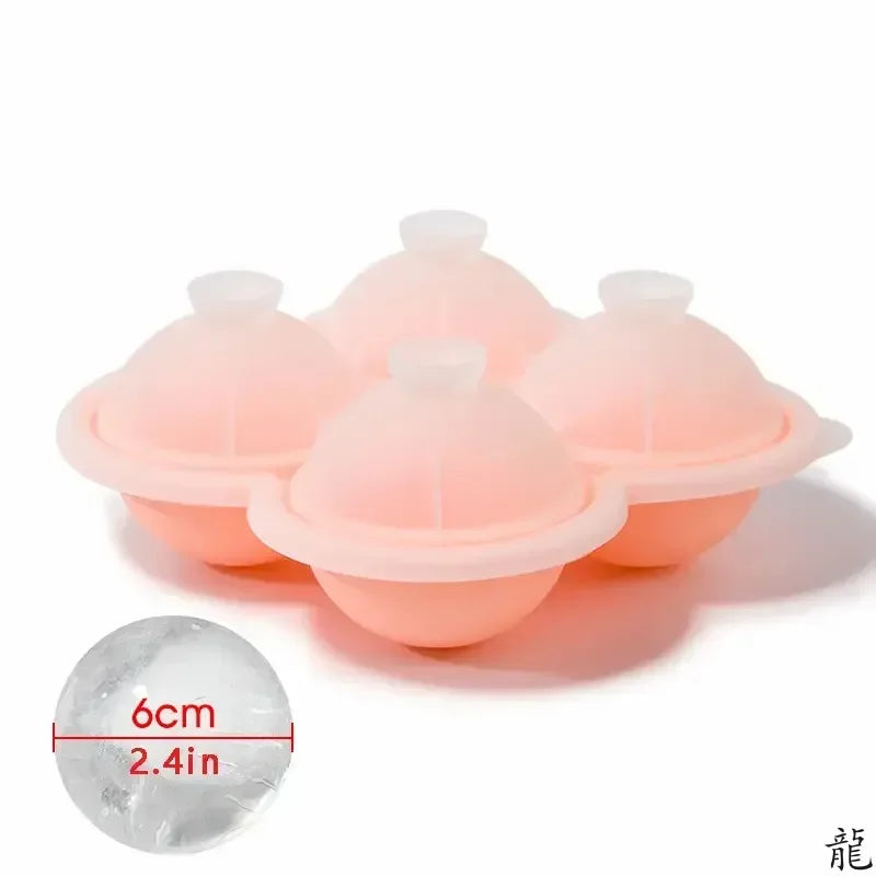 A set of pink silicone ice cube trays and a single clear ice cube are shown on a white background.