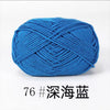 A ball of bright blue 4-ply milk cotton yarn for knitting and crochet.