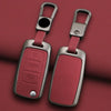 A pair of metallic car key case covers in a dusty rose color with silver clasps and rectangular key holders.