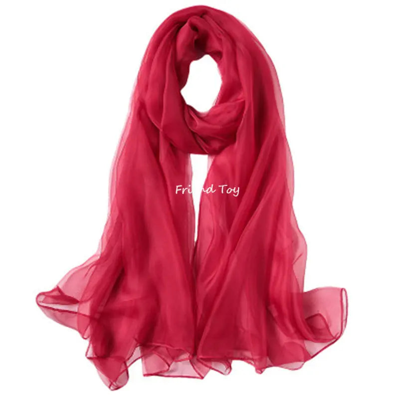 A vibrant red silk scarf draped elegantly