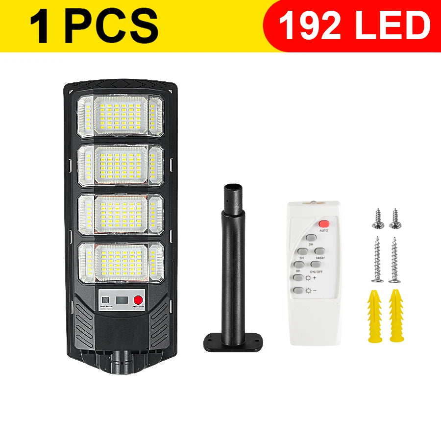 A black solar wall light with 192 LEDs and a remote control, shown next to replacement LED bulbs.