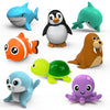A set of eight wind-up sea animal bath toys including a blue dolphin, a black penguin, an orange fish, a green turtle, an ora