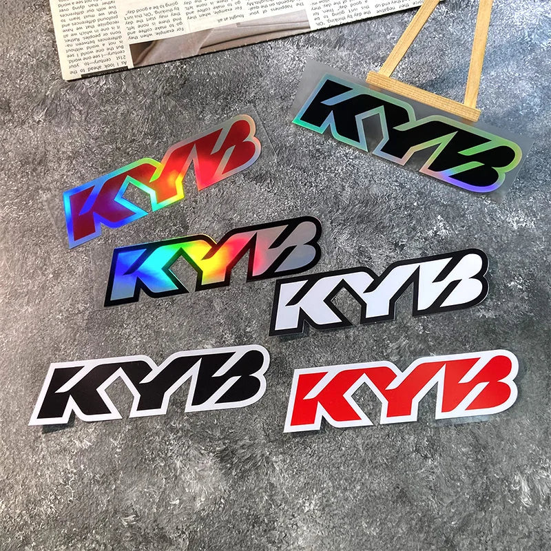 A collection of colorful and black motorcycle fork stickers featuring the letters KYB