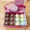 A box of pink and white crispy handmade stress balls with a 'Have a nice day' message and a cute elephant design.