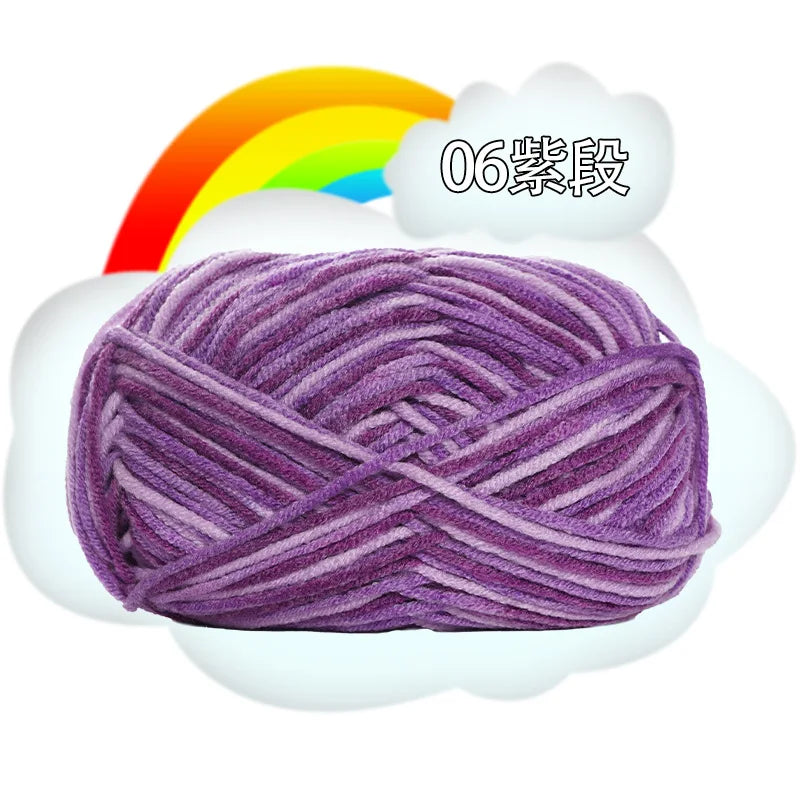 Purple milk cotton blend yarn skein with a rainbow background and the text 06 level.