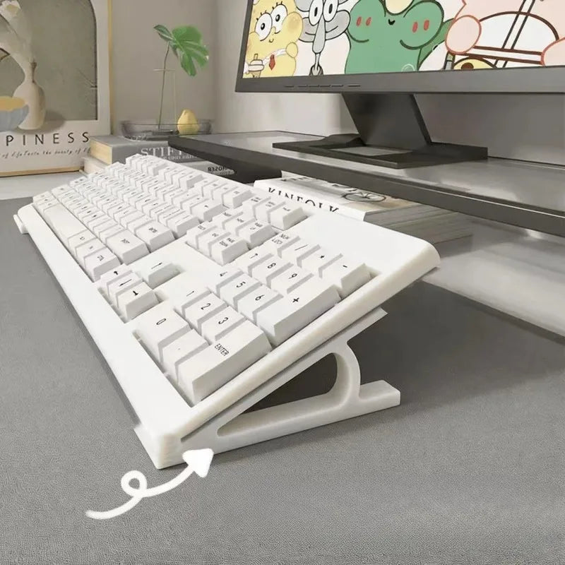 A white ergonomic keyboard riser with a non-slip base is shown in a home office setting.