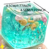A clear blue squishy toy filled with sea creatures and bubbles for sensory play.