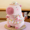 A pink kawaii capybara plush toy wearing a floral dress with a yellow duck swim ring.