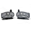 Black front fog light assembly for Cadillac Escalade, featuring clear bulbs and a mounting bracket.