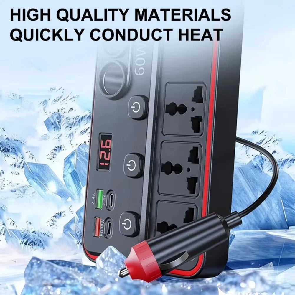 A black portable power inverter with dual AC outlets and USB ports is shown against a snowy background.